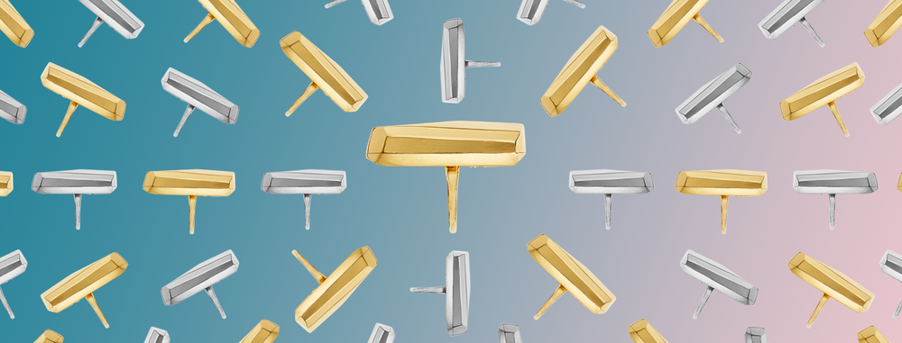 gold and silver Palma rings on a pink gradient