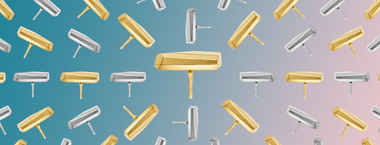 gold and silver Palma rings on a pink gradient